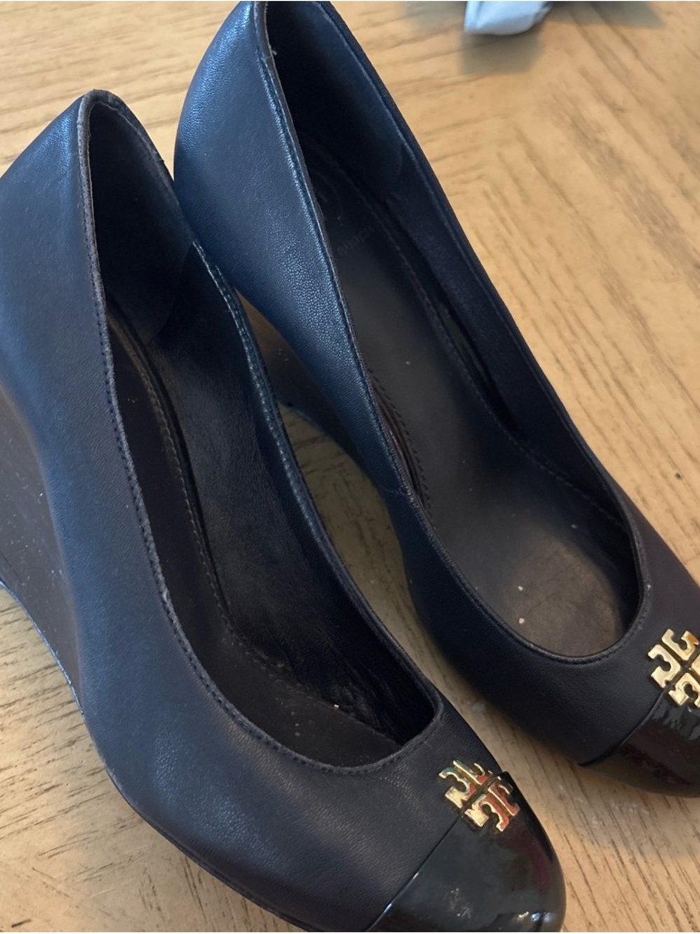 Tory Burch Black Leather Wedge Pumps with Gold Logo Cap Toe